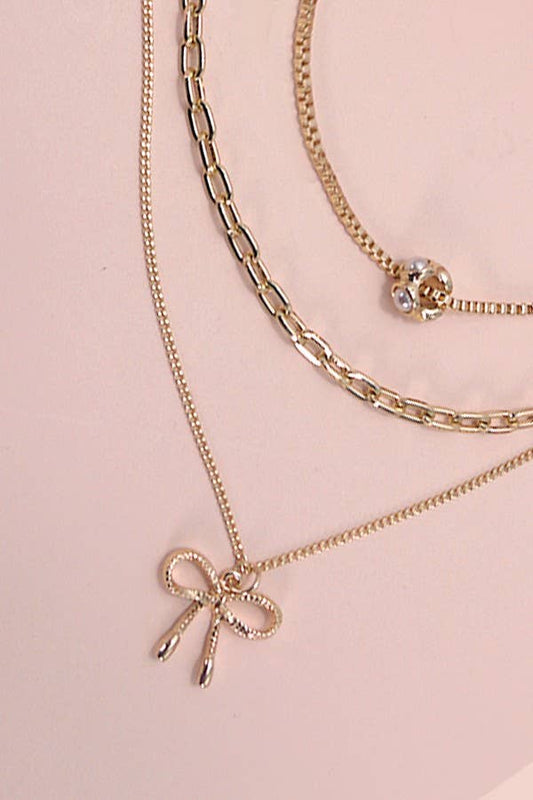MULTI LAYER PEARL BOW CAHRM NECKLACE
