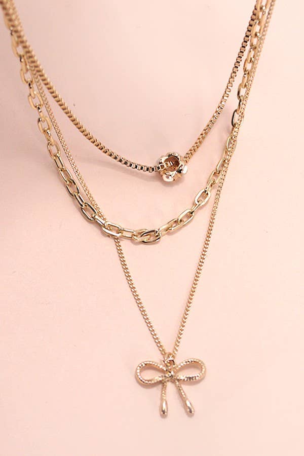 MULTI LAYER PEARL BOW CAHRM NECKLACE