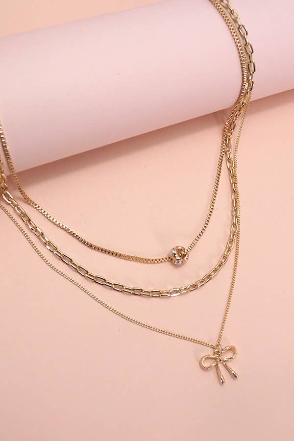 MULTI LAYER PEARL BOW CAHRM NECKLACE